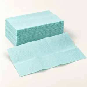 A stack of aqua dental patient bibs
