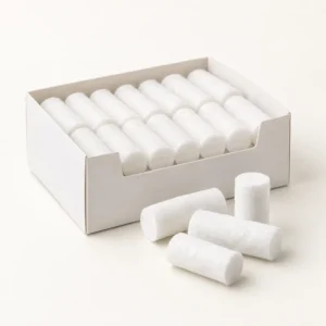 White dental cotton rolls in an open carton
